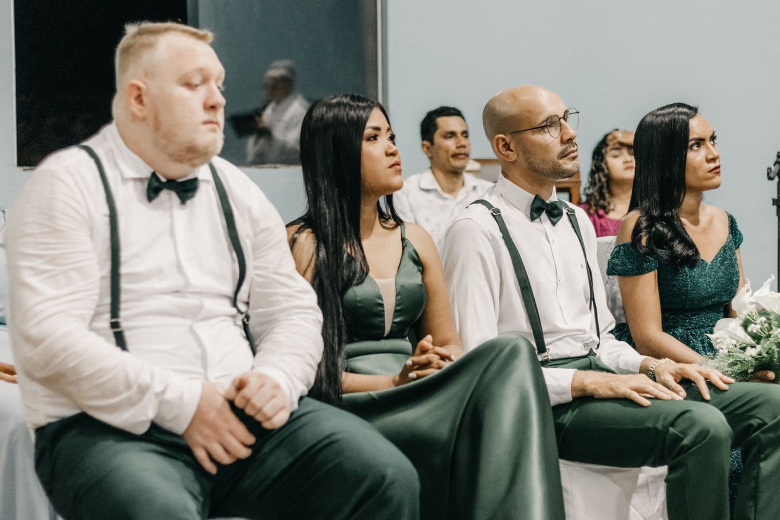 Wedding guests seated and watching during the ceremony